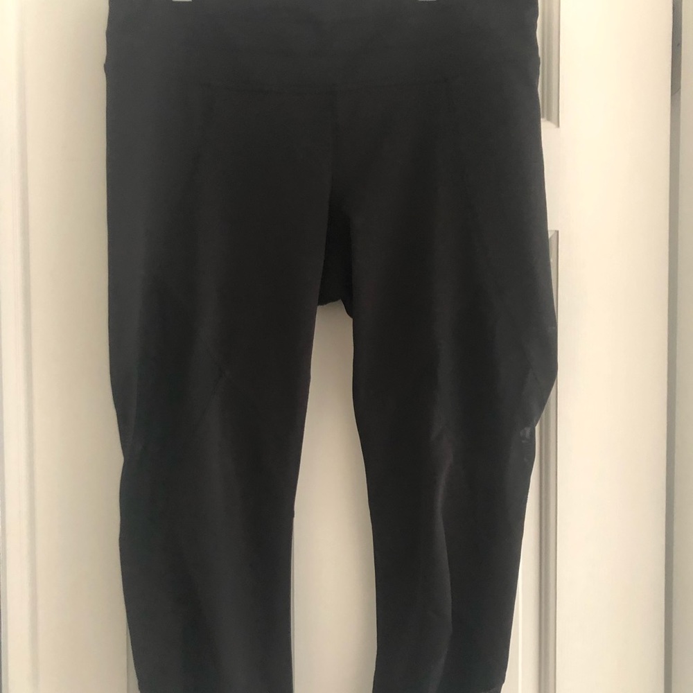 Athleta cropping leggings with mesh on the side.